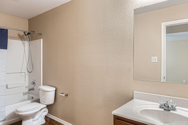 3803 Ponderosa Bnd, San Antonio, TX 78261 - bathroom featuring vanity, toilet, shower / bathtub combination, and a textured wall