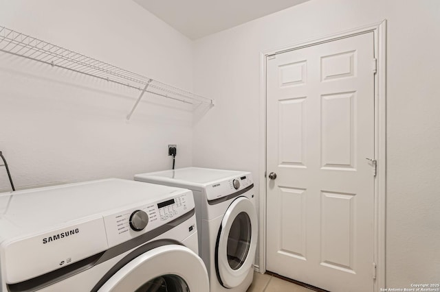 3803 Ponderosa Bnd, San Antonio, TX 78261 - laundry room featuring washing machine and dryer and light tile patterned floors
