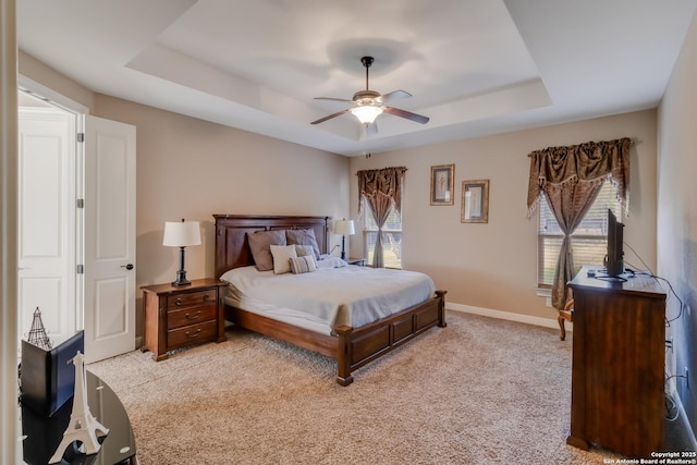 364 Stone Trl, Castroville, TX 78009 - bedroom with a tray ceiling, light colored carpet, baseboards, and a ceiling fan