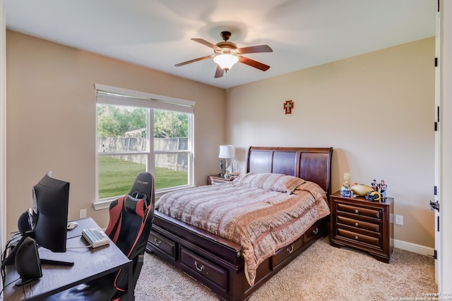 364 Stone Trl, Castroville, TX 78009 - bedroom featuring light carpet, a desk, ceiling fan, and baseboards