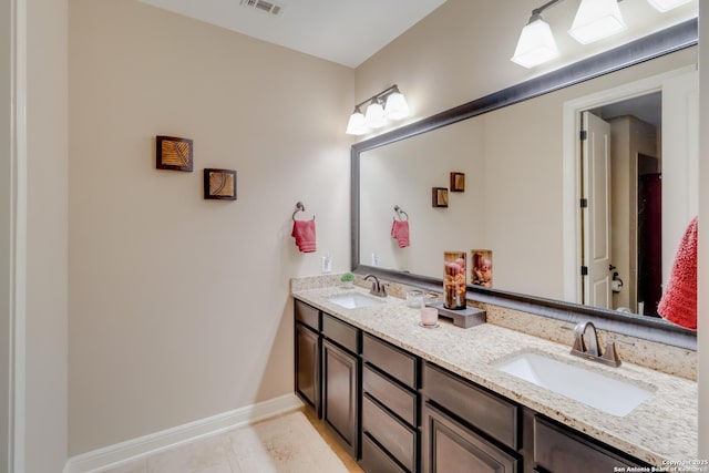 364 Stone Trl, Castroville, TX 78009 - bathroom with double vanity and baseboards