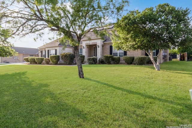 364 Stone Trl, Castroville, TX 78009 - view of front of home with a front yard and brick siding