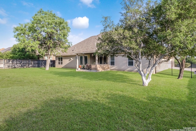 364 Stone Trl, Castroville, TX 78009 - back of property featuring a patio area and roof with shingles
