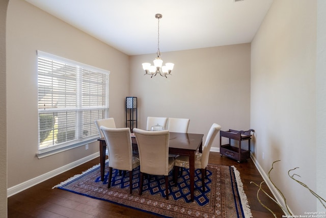 364 Stone Trl, Castroville, TX 78009 - dining room with a chandelier, wood finished floors, and baseboards