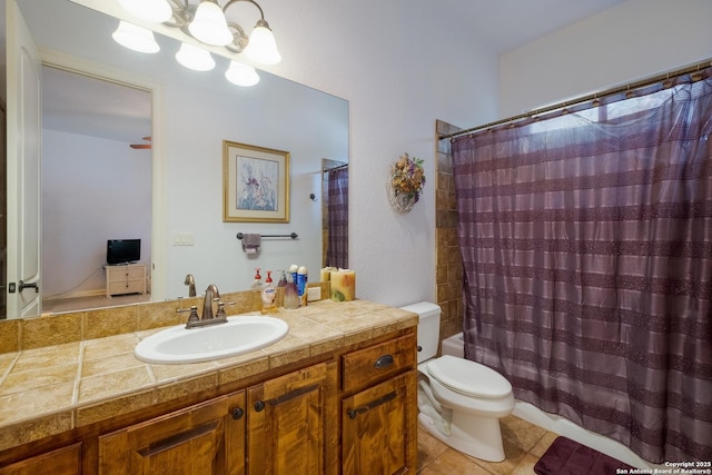10402 Oak Forest Way, New Braunfels, TX 78132 - full bathroom featuring vanity, toilet, tile patterned floors, and shower / bath combo with shower curtain