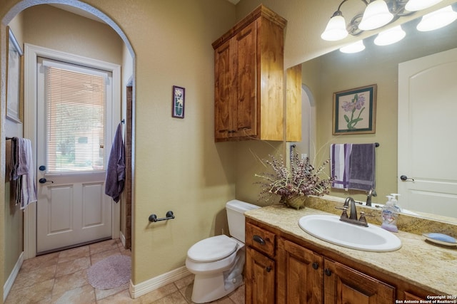 10402 Oak Forest Way, New Braunfels, TX 78132 - bathroom featuring vanity, toilet, and baseboards