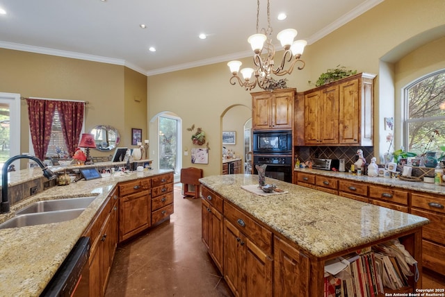 10402 Oak Forest Way, New Braunfels, TX 78132 - kitchen with black appliances, arched walkways, a sink, healthy amount of natural light, and crown molding