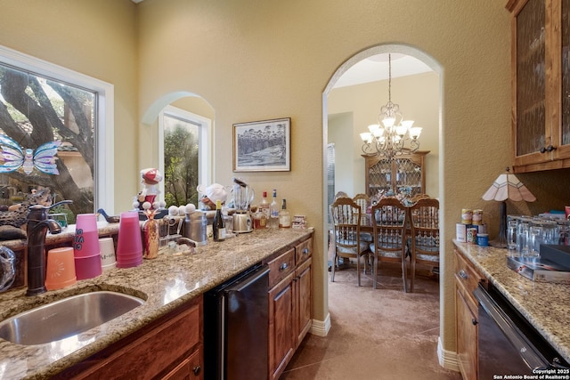 10402 Oak Forest Way, New Braunfels, TX 78132 - kitchen featuring a sink, dishwasher, light stone countertops, and a textured wall