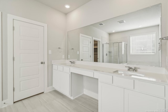 29414 Angelfish Blvd, Boerne, TX 78006 - full bath with a stall shower, double vanity, a walk in closet, recessed lighting, and baseboards