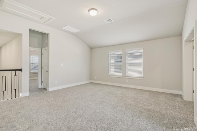 29414 Angelfish Blvd, Boerne, TX 78006 - carpeted empty room with vaulted ceiling, baseboards, and attic access