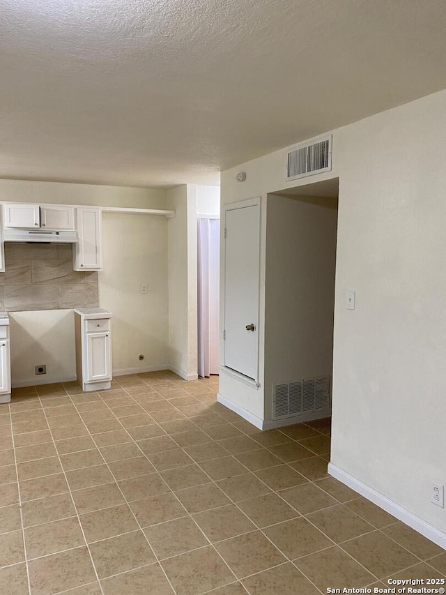 1336 Churing, San Antonio, TX 78245 - spare room with light tile patterned flooring and baseboards