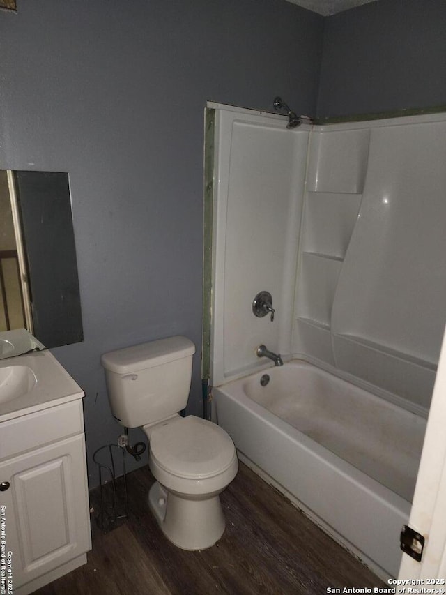 2960 Ash Fld, San Antonio, TX 78245 - bathroom with wood finished floors, toilet, vanity, and washtub / shower combination