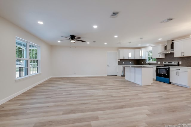 7811 Stagecoach, San Antonio, TX 78227 - kitchen featuring range with electric stovetop, wall chimney range hood, healthy amount of natural light, recessed lighting, and a ceiling fan