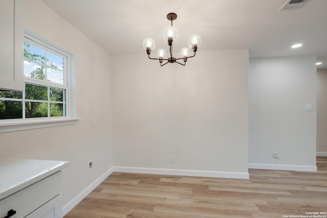 7811 Stagecoach, San Antonio, TX 78227 - unfurnished dining area featuring light wood-type flooring, a chandelier, baseboards, and recessed lighting