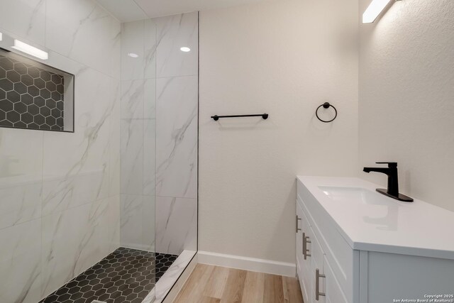7811 Stagecoach, San Antonio, TX 78227 - full bathroom featuring a marble finish shower, vanity, and wood finished floors