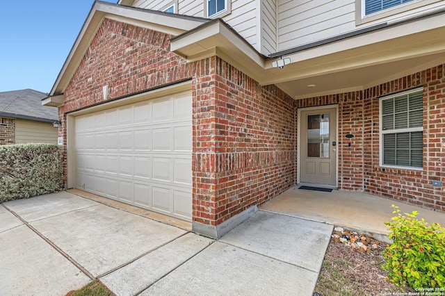 4811 Tee Box Ct, San Antonio, TX 78261 - property entrance featuring brick siding, concrete driveway, and an attached garage