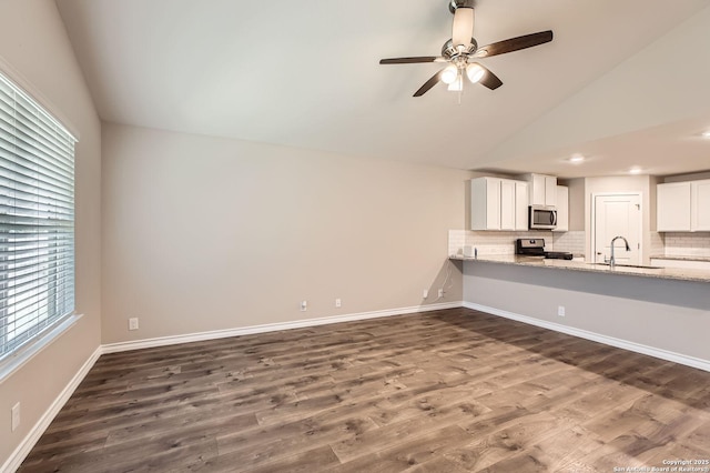 4811 Tee Box Ct, San Antonio, TX 78261 - unfurnished living room featuring a sink, dark wood-style floors, a ceiling fan, baseboards, and recessed lighting
