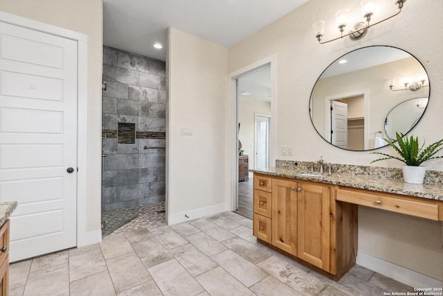 1015 Broken Spoke, Canyon Lake, TX 78133 - bathroom with vanity, walk in shower, recessed lighting, and baseboards