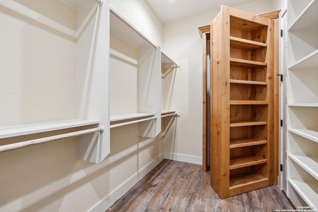 1015 Broken Spoke, Canyon Lake, TX 78133 - spacious closet with dark wood-style flooring