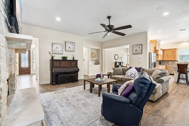 1015 Broken Spoke, Canyon Lake, TX 78133 - living room featuring light wood-style floors, a ceiling fan, recessed lighting, and baseboards