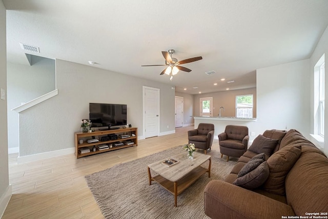 324 Mar Hl, Seguin, TX 78155 - living area featuring ceiling fan, baseboards, light wood-style floors, and recessed lighting