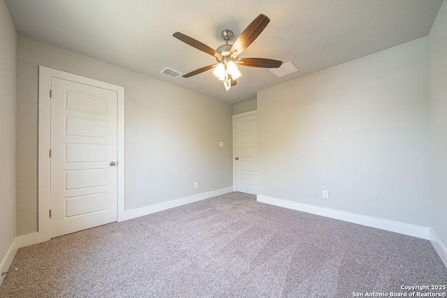 324 Mar Hl, Seguin, TX 78155 - unfurnished bedroom featuring carpet flooring, baseboards, and ceiling fan