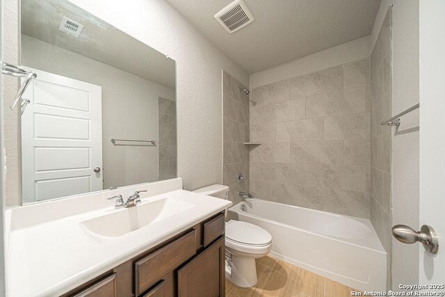 324 Mar Hl, Seguin, TX 78155 - full bathroom featuring toilet, vanity, and washtub / shower combination