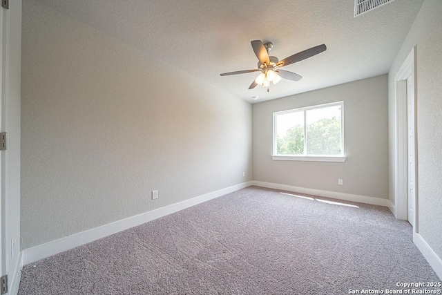 324 Mar Hl, Seguin, TX 78155 - carpeted spare room with ceiling fan, baseboards, and a textured ceiling