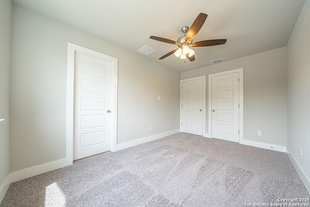 324 Mar Hl, Seguin, TX 78155 - unfurnished bedroom featuring carpet floors, baseboards, and ceiling fan