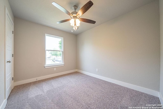324 Mar Hl, Seguin, TX 78155 - carpeted spare room featuring baseboards and a ceiling fan