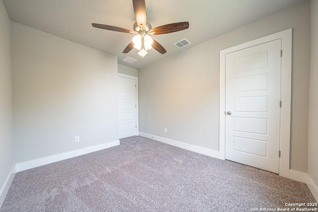 324 Mar Hl, Seguin, TX 78155 - unfurnished bedroom with carpet, baseboards, and a ceiling fan