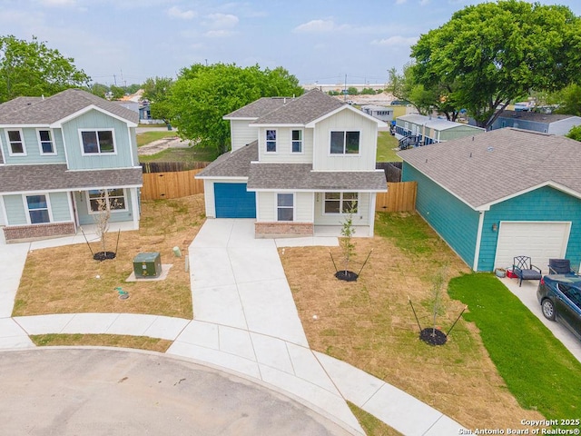 324 Mar Hl, Seguin, TX 78155 - traditional-style house featuring concrete driveway, roof with shingles, and an attached garage