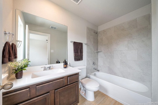 324 Mar Hl, Seguin, TX 78155 - bathroom featuring vanity, toilet,  shower combination, and wood finished floors