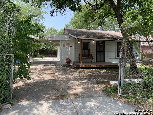 261 San Gabriel, San Antonio, TX 78237 - view of front of property featuring concrete driveway, a porch, and an attached carport