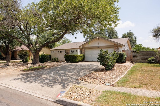 5006 Las Campanas, San Antonio, TX 78233 - ranch-style home with a garage and driveway