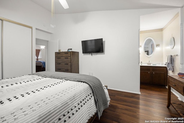 5006 Las Campanas, San Antonio, TX 78233 - bedroom featuring dark wood-style floors, a sink, a closet, baseboards, and ensuite bathroom