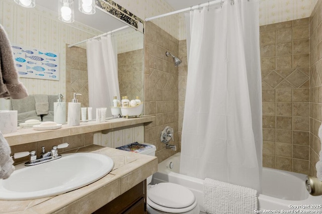 5006 Las Campanas, San Antonio, TX 78233 - full bath with wallpapered walls, shower / bath combination with curtain, vanity, and toilet