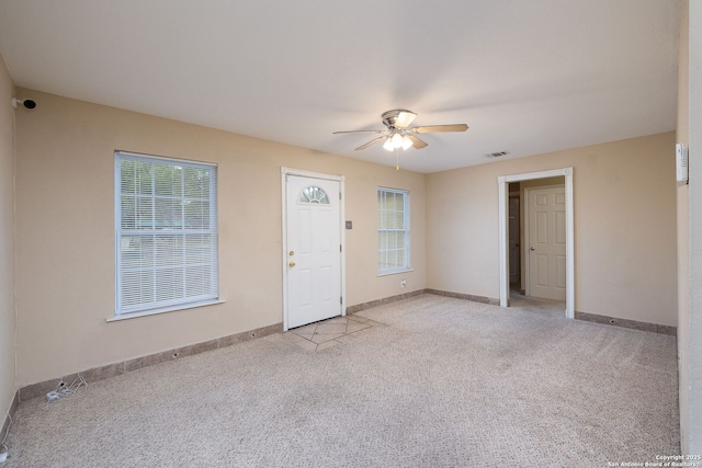430 Demya, San Antonio, TX 78227 - foyer with a ceiling fan, light colored carpet, plenty of natural light, and baseboards