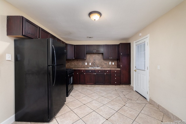 430 Demya, San Antonio, TX 78227 - kitchen with black appliances, a sink, light tile patterned flooring, decorative backsplash, and dark brown cabinets