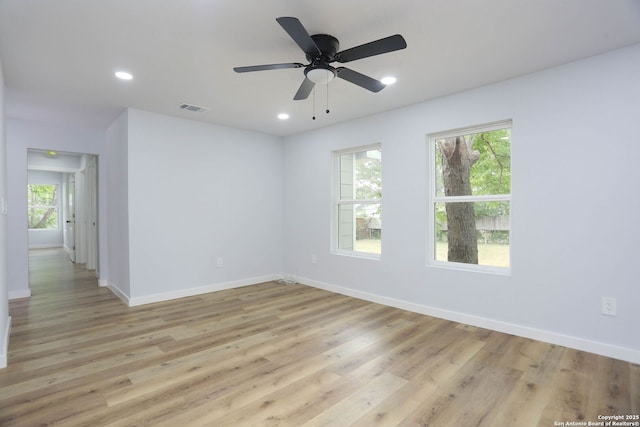 242 Babcock Rd, San Antonio, TX 78201 - unfurnished room with plenty of natural light, baseboards, light wood-style flooring, and recessed lighting