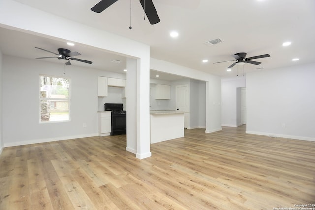 242 Babcock Rd, San Antonio, TX 78201 - unfurnished living room with a ceiling fan, recessed lighting, light wood-type flooring, and baseboards