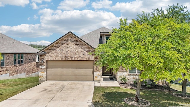 2730 Tortuga Verde, San Antonio, TX 78245 - view of front of home with a garage, concrete driveway, roof with shingles, and brick siding