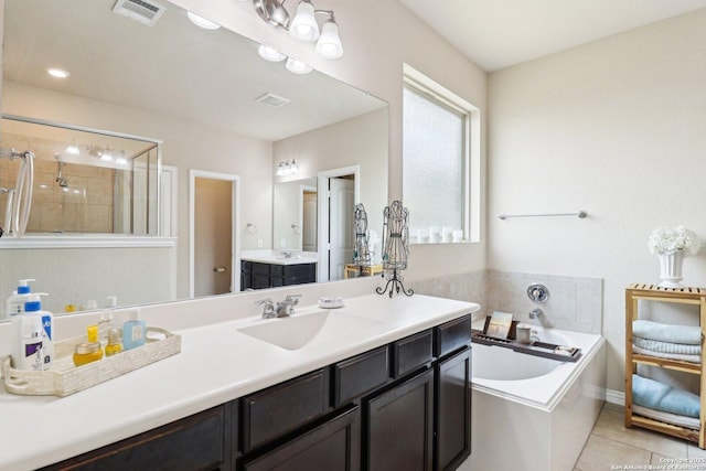 2730 Tortuga Verde, San Antonio, TX 78245 - full bath with a garden tub, vanity, tiled shower, and tile patterned flooring