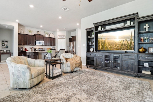 2730 Tortuga Verde, San Antonio, TX 78245 - living room featuring light tile patterned flooring, a ceiling fan, recessed lighting, and baseboards