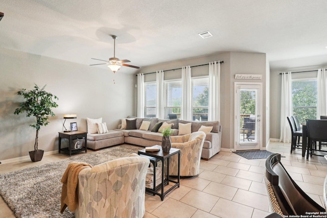 2730 Tortuga Verde, San Antonio, TX 78245 - living area featuring a ceiling fan, light tile patterned floors, and baseboards