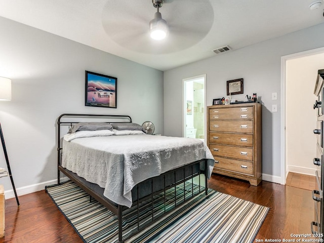 3318 Stone Cave, San Antonio, TX 78247 - bedroom featuring dark wood-type flooring, baseboards, ensuite bathroom, and a ceiling fan