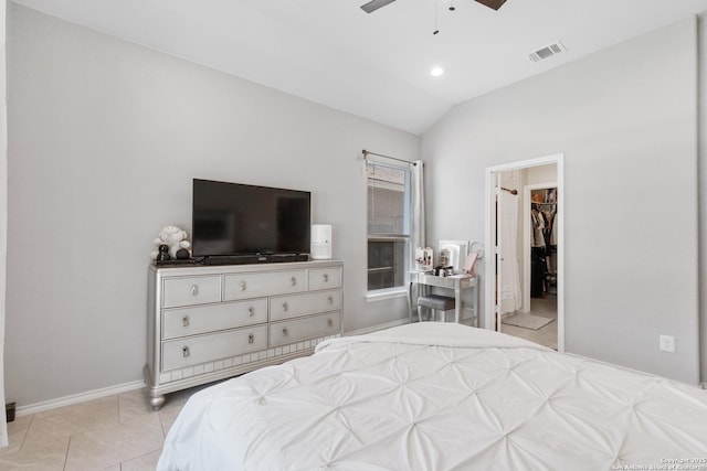 422 42nd, San Antonio, TX 78237 - tiled bedroom featuring lofted ceiling, a walk in closet, baseboards, and a ceiling fan