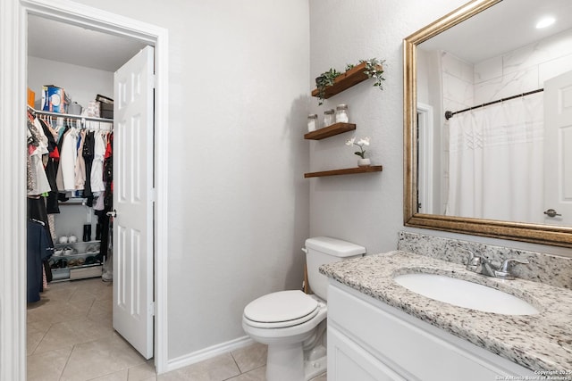 422 42nd, San Antonio, TX 78237 - bathroom featuring vanity, tile patterned floors, toilet, a walk in closet, and curtained shower