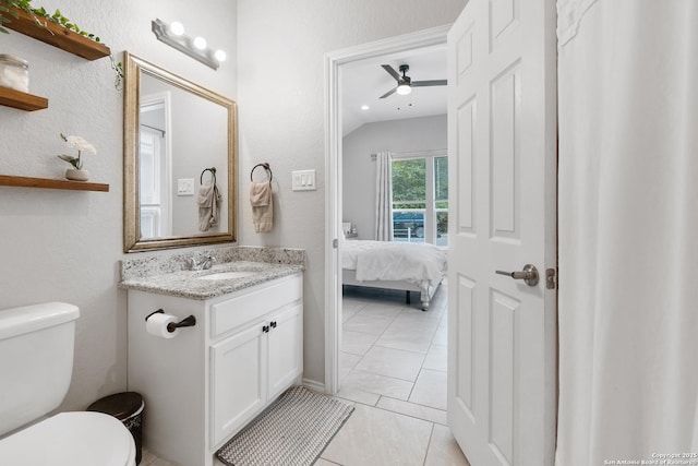 422 42nd, San Antonio, TX 78237 - ensuite bathroom featuring vanity, toilet, tile patterned floors, lofted ceiling, and a ceiling fan