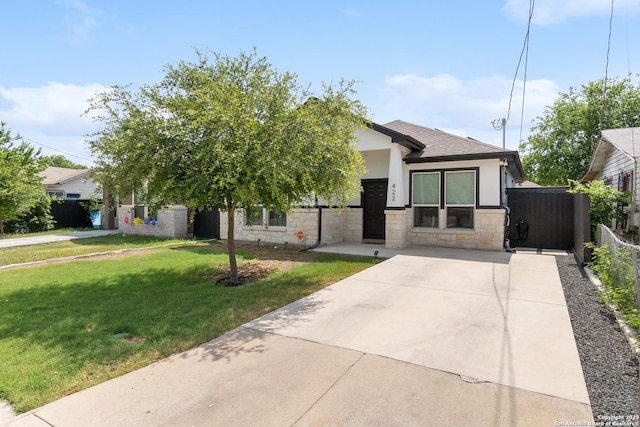 422 42nd, San Antonio, TX 78237 - view of front of property with stone siding, stucco siding, a shingled roof, and concrete driveway